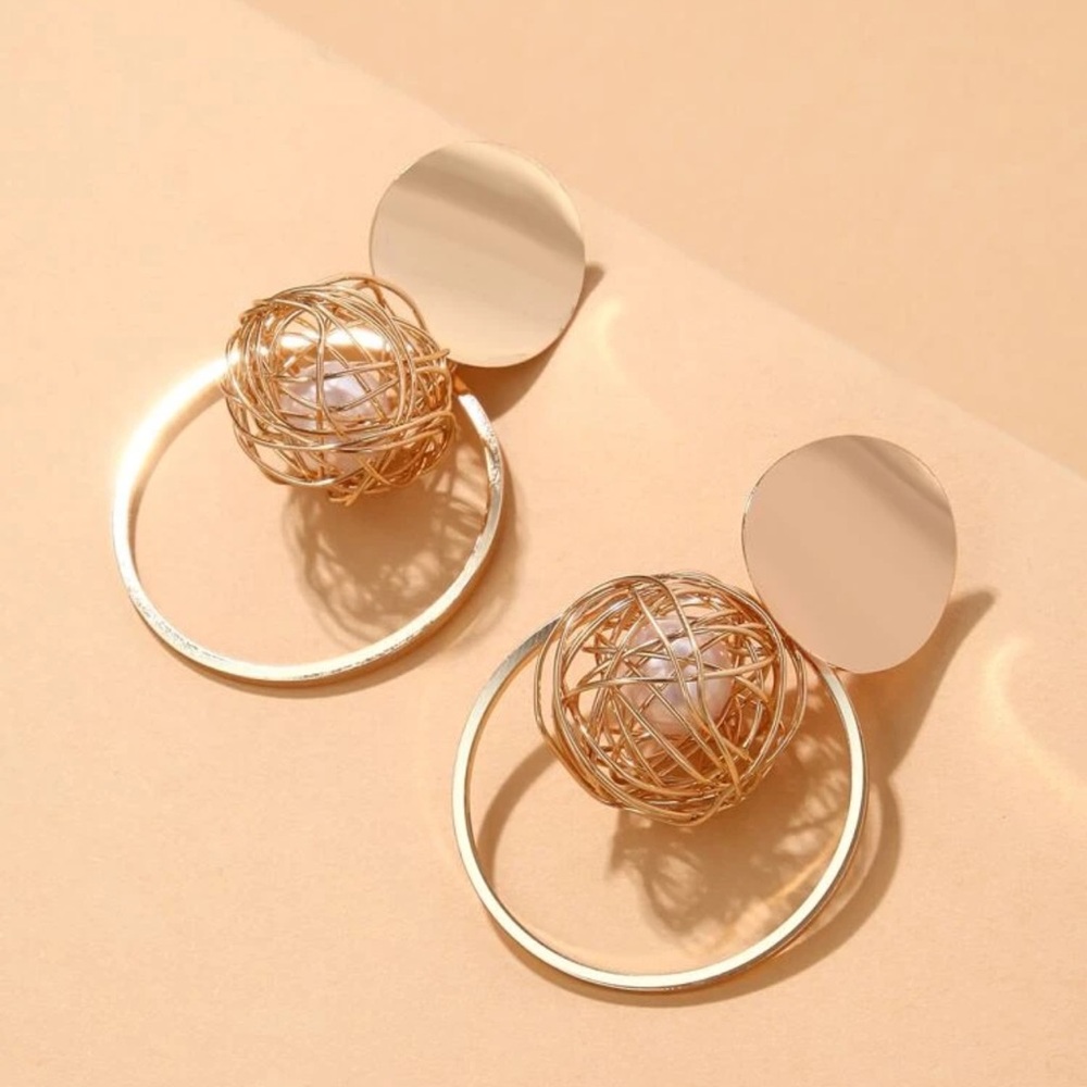 Women jewelry gold drop designer earrings with pearl.
